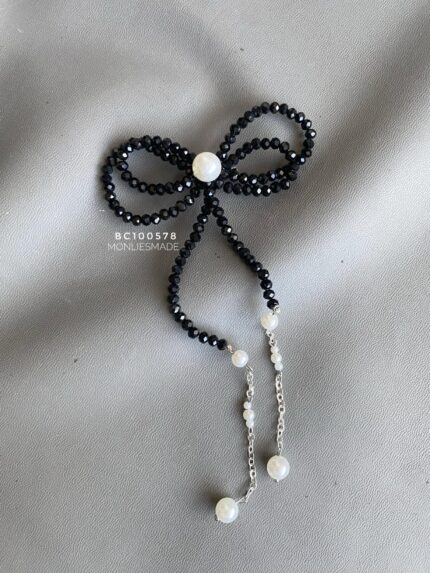 BC100578 - Bow Crystal Brooch with Tusle - Black