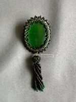 BC100326002- Scarlet Oval Brooch with Tassel